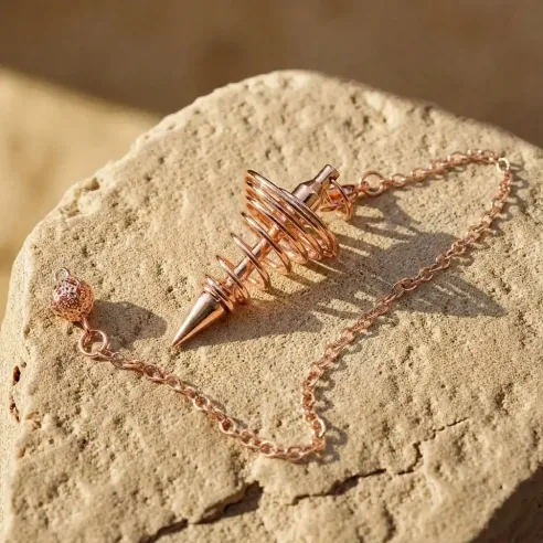 Pendule spirale rose doré – outil radiesthésie & divination